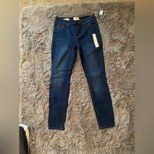 Mid Rise Skinny dark wash jeans- Size 2